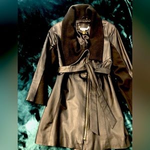 Black belted Moto jacket with knitted collar. Brand:IMAN. Size:Medium.